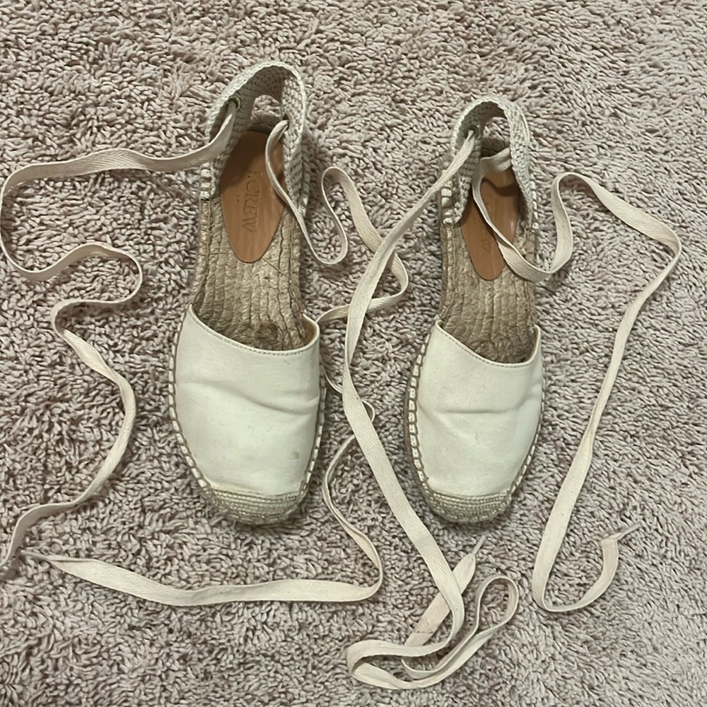 Cream colored espadrille tie up shoes with ribbon laces